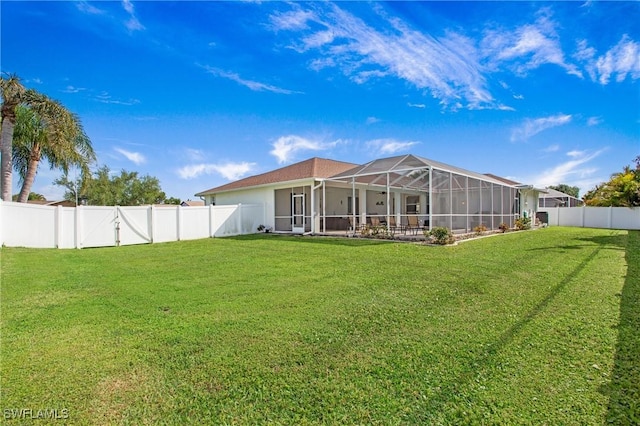 1824 SE 20th Ln, Cape Coral, FL 33990 - back of property featuring a yard and a fenced backyard