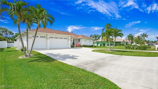 1824 SE 20th Ln, Cape Coral, FL 33990 - ranch-style house with fence, an attached garage, a front lawn, and driveway
