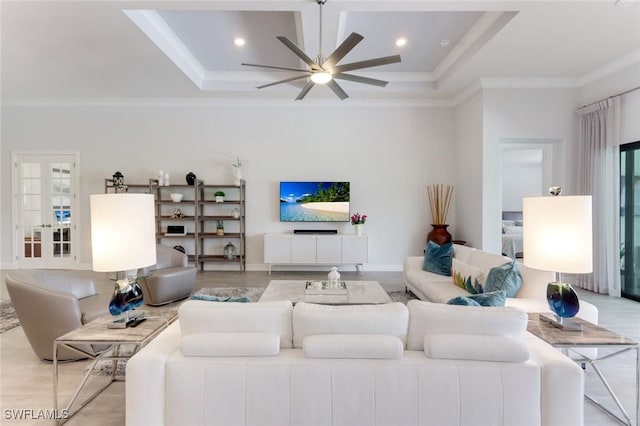 living room with ceiling fan, coffered ceiling, ornamental molding, and recessed lighting