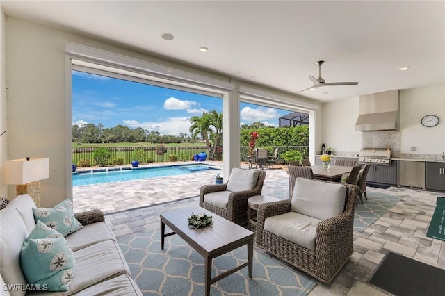 view of patio featuring outdoor dining space, fence, a fenced in pool, exterior kitchen, and ceiling fan