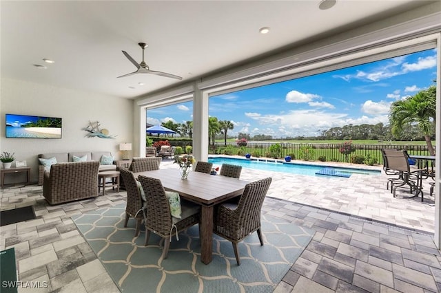 view of patio featuring a fenced in pool, fence, outdoor lounge area, ceiling fan, and outdoor dining space