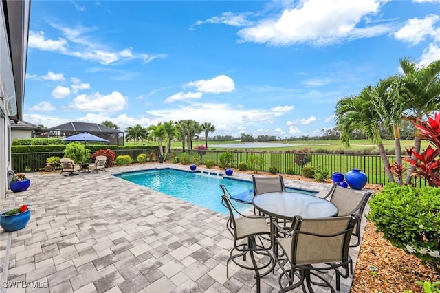 view of swimming pool with a fenced backyard, a patio, and a fenced in pool