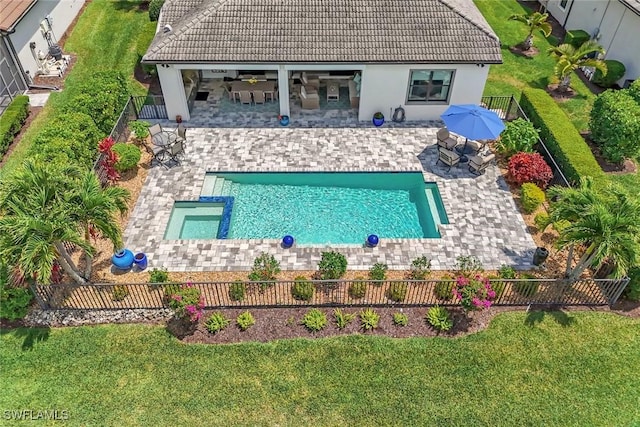 view of swimming pool featuring a fenced backyard, a yard, a patio area, and a fenced in pool
