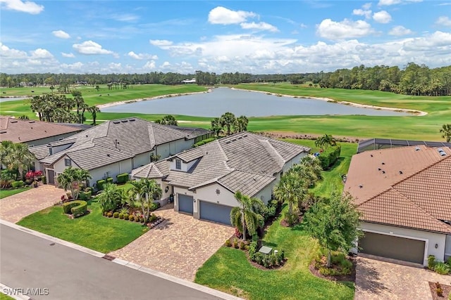 aerial view featuring golf course view and a water view
