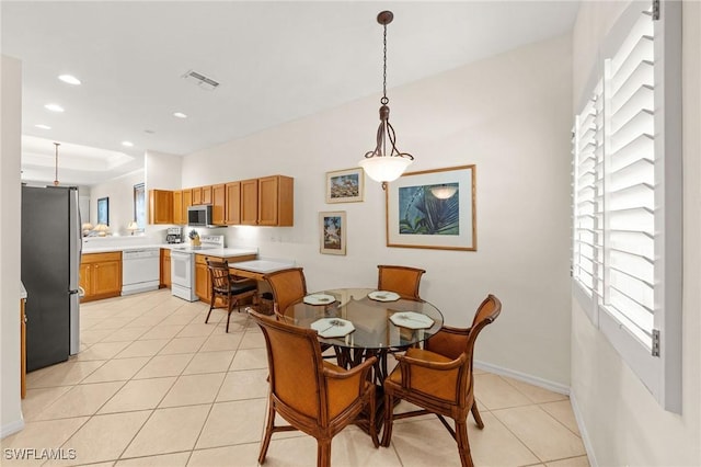 6683 Castlelawn Pl, Naples, FL 34113 - dining space featuring visible vents, baseboards, a raised ceiling, light tile patterned floors, and recessed lighting