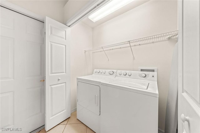 6683 Castlelawn Pl, Naples, FL 34113 - clothes washing area featuring separate washer and dryer, laundry area, and light tile patterned flooring