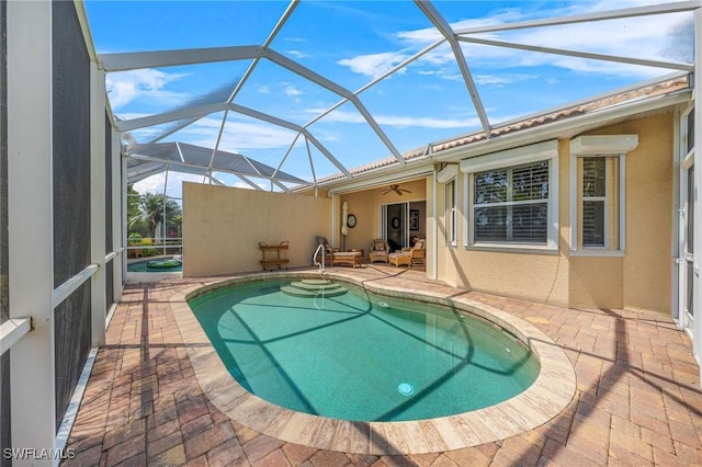 6683 Castlelawn Pl, Naples, FL 34113 - outdoor pool with a patio, glass enclosure, and a ceiling fan
