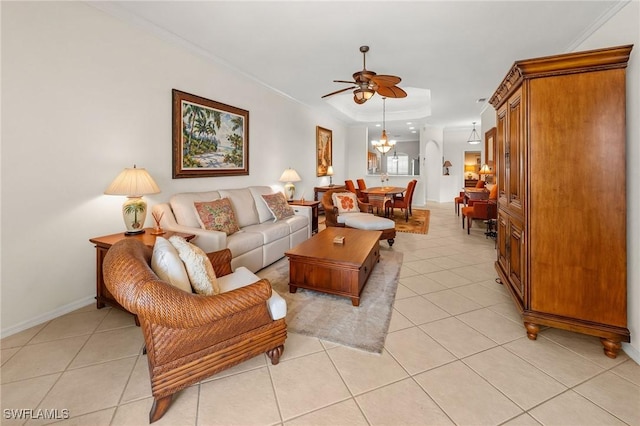 6683 Castlelawn Pl, Naples, FL 34113 - living area featuring a raised ceiling, ceiling fan, baseboards, and light tile patterned floors
