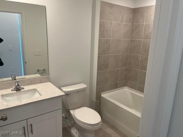 20160 Caroline Creek Pl, Lehigh Acres, FL 33974 - full bathroom featuring vanity, toilet, and shower / bath combination