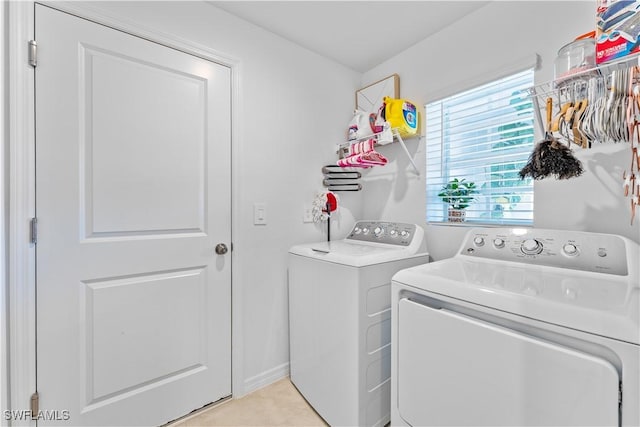 20160 Caroline Creek Pl, Lehigh Acres, FL 33974 - washroom with washing machine and dryer and light tile patterned flooring