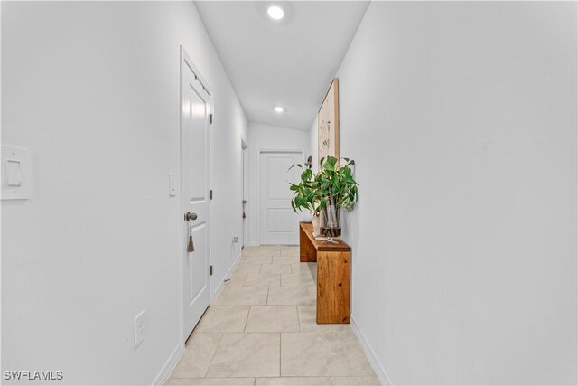 20160 Caroline Creek Pl, Lehigh Acres, FL 33974 - corridor with recessed lighting, baseboards, and light tile patterned flooring