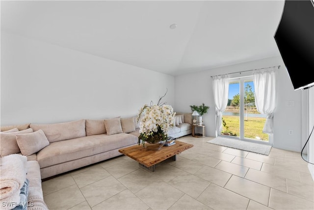 20160 Caroline Creek Pl, Lehigh Acres, FL 33974 - living room featuring vaulted ceiling and light tile patterned flooring