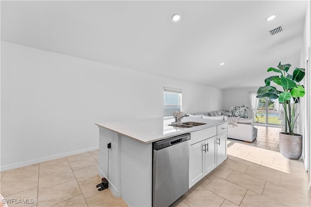20160 Caroline Creek Pl, Lehigh Acres, FL 33974 - kitchen with stainless steel dishwasher, a sink, open floor plan, healthy amount of natural light, and vaulted ceiling