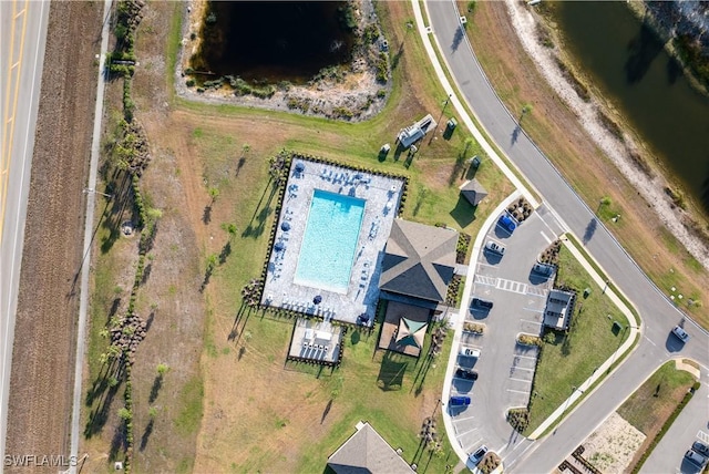 20160 Caroline Creek Pl, Lehigh Acres, FL 33974 - drone / aerial view of a large body of water and a pool area