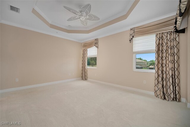 6532 Monterey Pt Unit 202, Naples, FL 34105 - spare room featuring a raised ceiling, ornamental molding, a ceiling fan, carpet, and baseboards