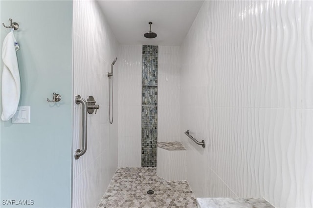 bathroom with tiled shower