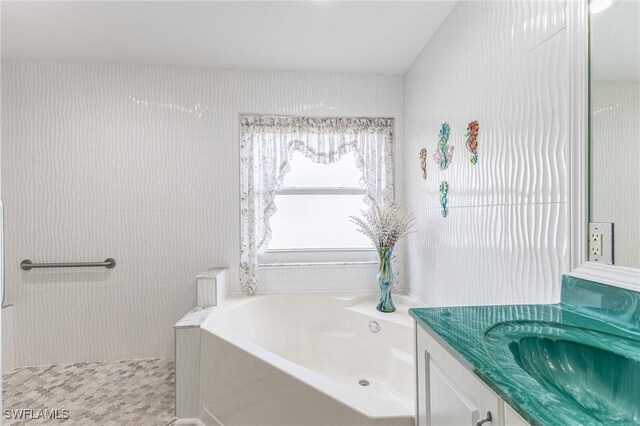 full bathroom featuring vanity and a bath