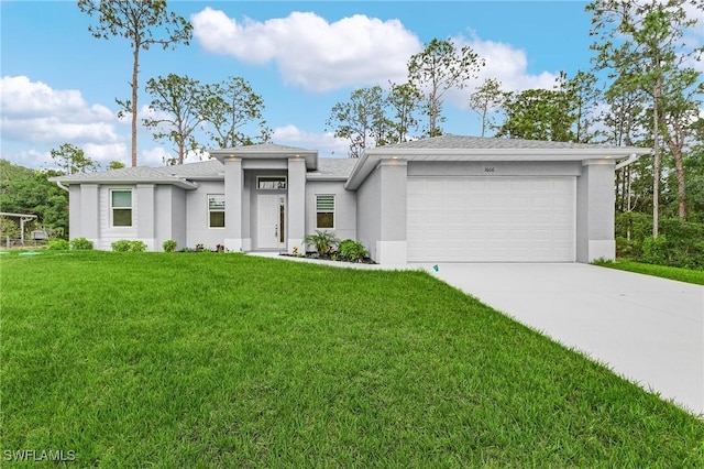 1606 Euclid Ave, Lehigh Acres, FL 33972 - prairie-style house featuring stucco siding, an attached garage, and a front yard
