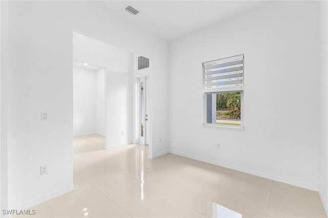 1606 Euclid Ave, Lehigh Acres, FL 33972 - spare room with baseboards and light tile patterned floors