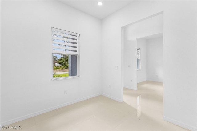 1606 Euclid Ave, Lehigh Acres, FL 33972 - unfurnished room featuring baseboards and recessed lighting