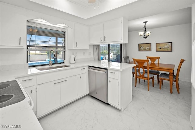kitchen featuring stainless steel dishwasher, an inviting chandelier, a peninsula, marble finish floor, and a sink