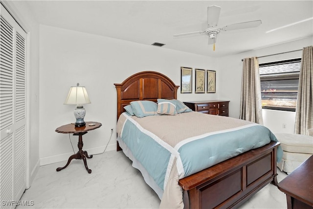 bedroom featuring baseboards, visible vents, a closet, and a ceiling fan