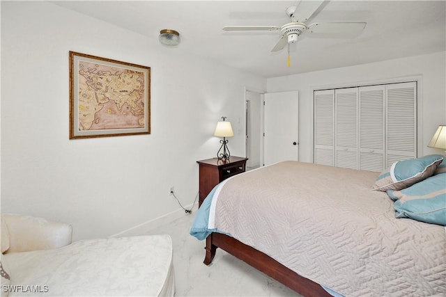 carpeted bedroom featuring a closet, baseboards, and a ceiling fan