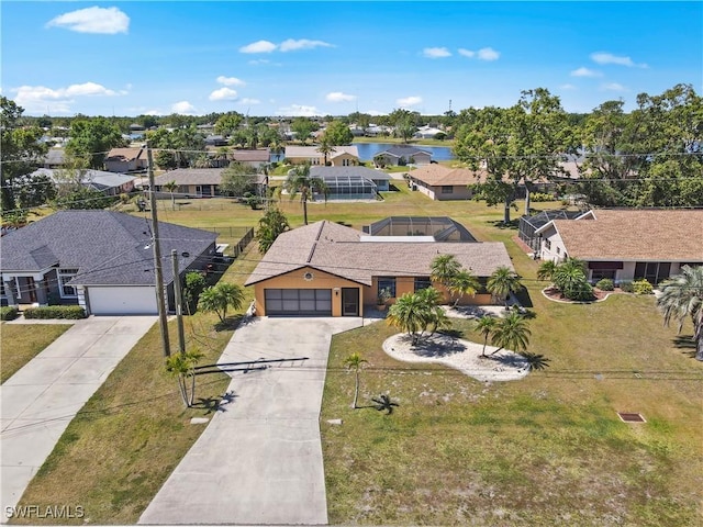 aerial view featuring a water view and a residential view