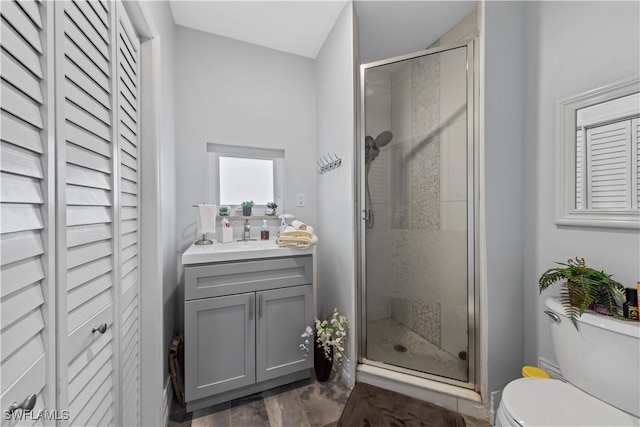 3586 Croton Rd, Naples, FL 34104 - full bath featuring toilet, vanity, a stall shower, and a closet