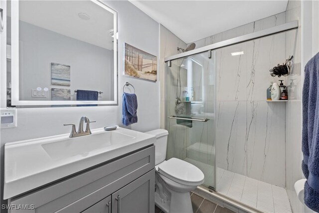 3586 Croton Rd, Naples, FL 34104 - full bathroom featuring toilet, vanity, and a marble finish shower