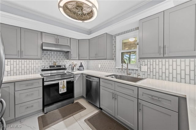 3586 Croton Rd, Naples, FL 34104 - kitchen with crown molding, stainless steel appliances, under cabinet range hood, gray cabinetry, and a sink