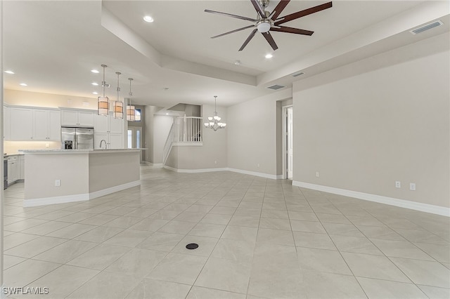 10079 Chesapeake Bay Dr, Fort Myers, FL 33913 - unfurnished living room with ceiling fan with notable chandelier, visible vents, recessed lighting, and baseboards