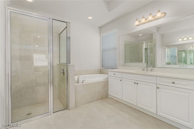 10079 Chesapeake Bay Dr, Fort Myers, FL 33913 - full bathroom featuring a stall shower, tile patterned flooring, vanity, and a garden tub