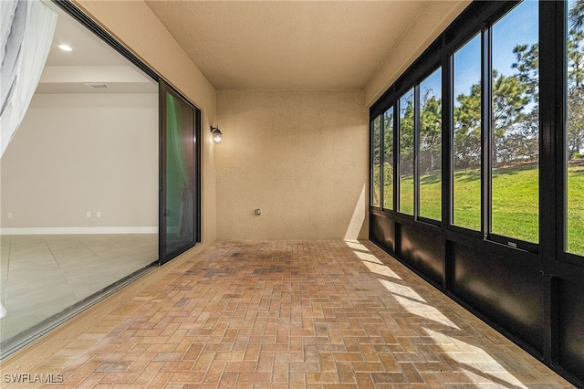 10079 Chesapeake Bay Dr, Fort Myers, FL 33913 - unfurnished sunroom with brick floor, visible vents, and recessed lighting
