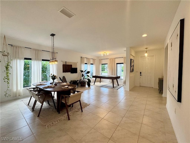 dining room with baseboards, visible vents, and light tile patterned floors