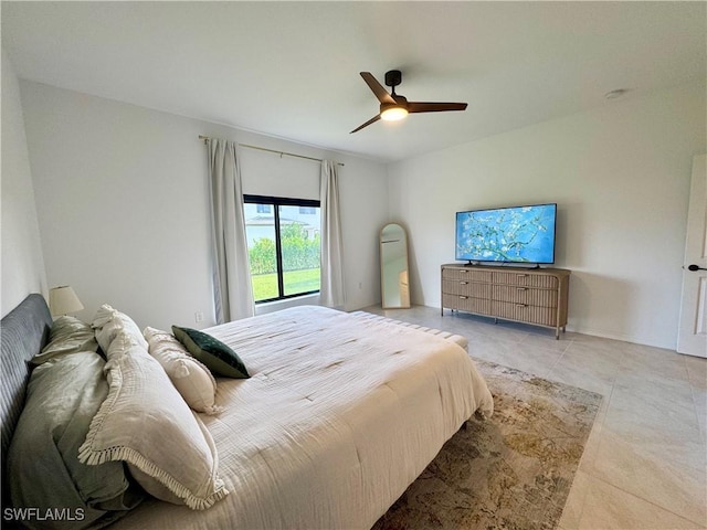 bedroom featuring a ceiling fan and light tile patterned floors