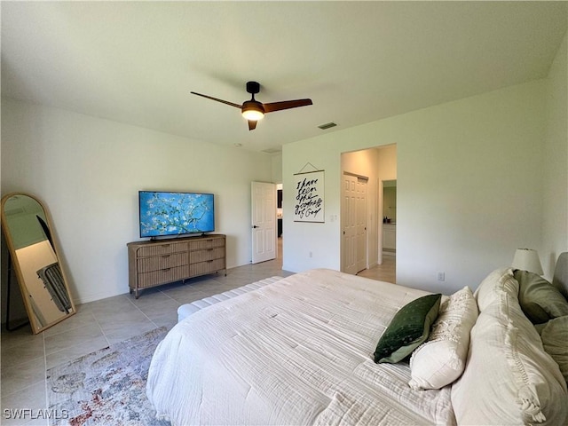 bedroom with a ceiling fan, light tile patterned floors, and visible vents