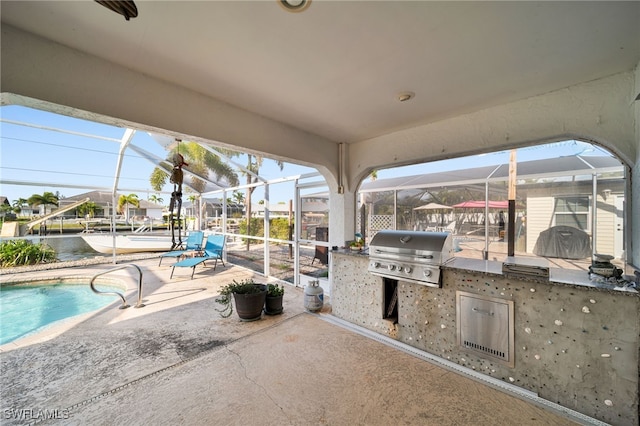 view of patio / terrace with an outdoor kitchen, a lanai, a grill, and an outdoor pool