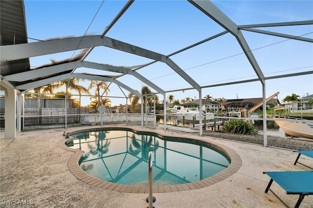 pool featuring fence, a lanai, and a patio area