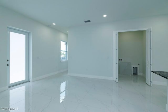 unfurnished room with recessed lighting, visible vents, and marble finish floor