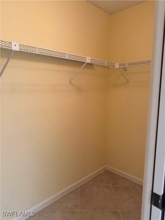4628 SW 18th Ave, Cape Coral, FL 33914 - walk in closet featuring tile patterned flooring