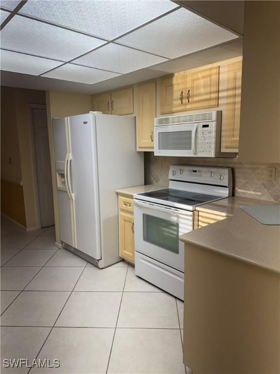 4628 SW 18th Ave, Cape Coral, FL 33914 - kitchen featuring a drop ceiling, light tile patterned flooring, light brown cabinetry, and white appliances