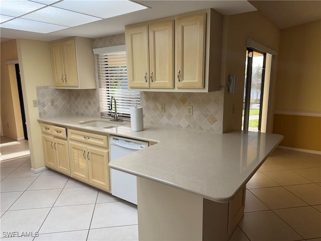 4628 SW 18th Ave, Cape Coral, FL 33914 - kitchen with dishwasher, light tile patterned floors, a peninsula, and a sink