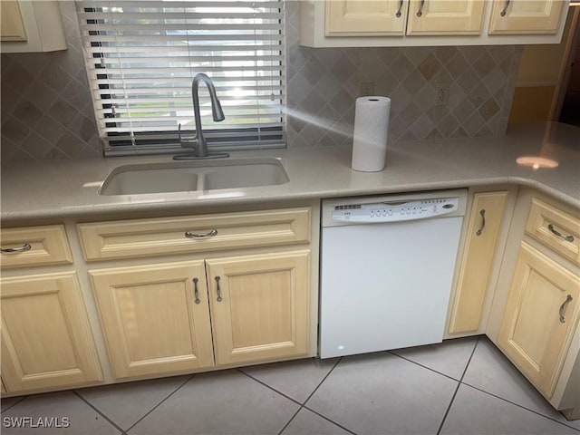 4628 SW 18th Ave, Cape Coral, FL 33914 - kitchen featuring light countertops, light tile patterned floors, white dishwasher, a sink, and light brown cabinets