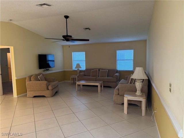 4628 SW 18th Ave, Cape Coral, FL 33914 - living room featuring visible vents, lofted ceiling, ceiling fan, and light tile patterned floors