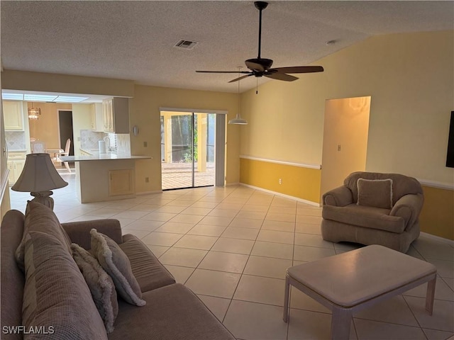 4628 SW 18th Ave, Cape Coral, FL 33914 - living room featuring light tile patterned flooring, lofted ceiling, visible vents, and a ceiling fan