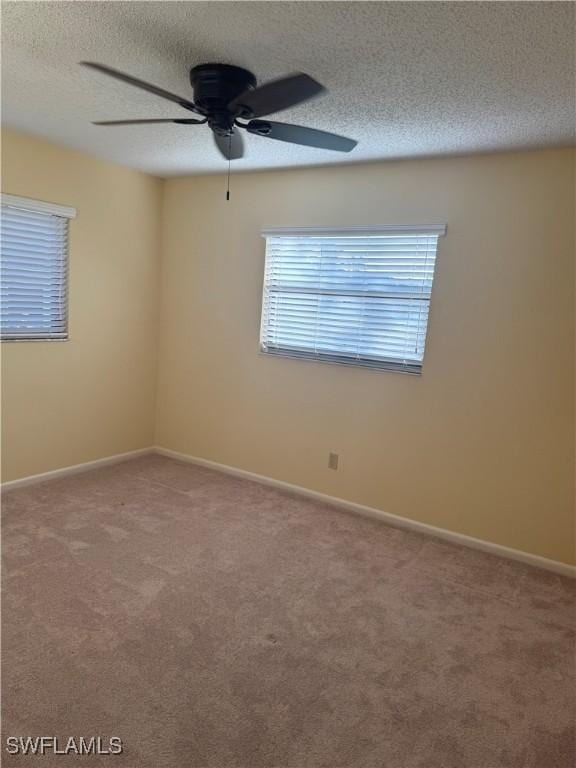 4628 SW 18th Ave, Cape Coral, FL 33914 - carpeted empty room featuring baseboards, a textured ceiling, and a ceiling fan