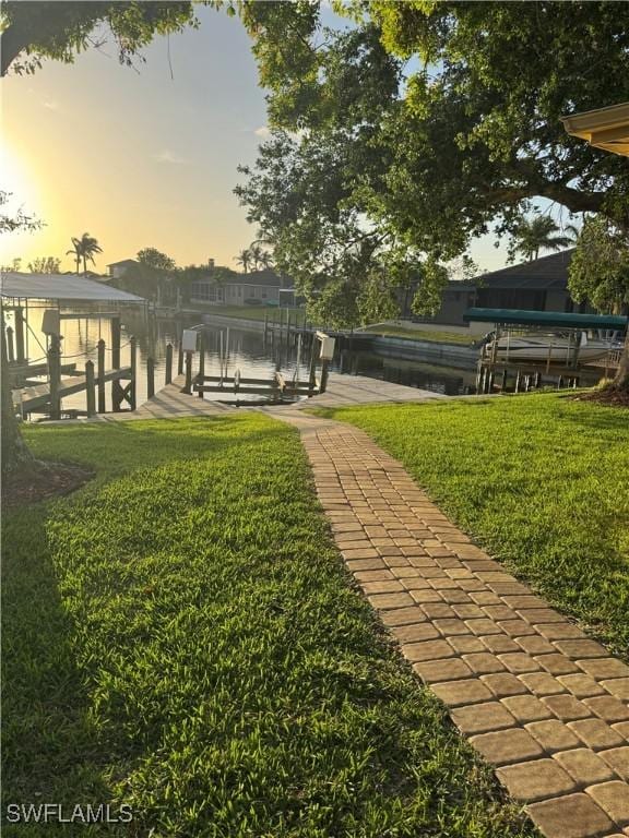 4628 SW 18th Ave, Cape Coral, FL 33914 - surrounding community featuring a water view, boat lift, a dock, and a yard