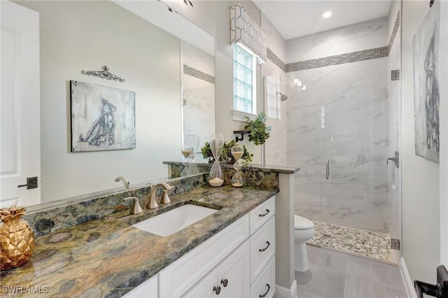 full bath with vanity, baseboards, recessed lighting, toilet, and a marble finish shower