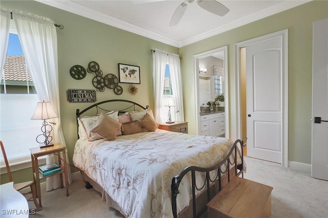 bedroom with baseboards, ornamental molding, ensuite bathroom, a ceiling fan, and light colored carpet